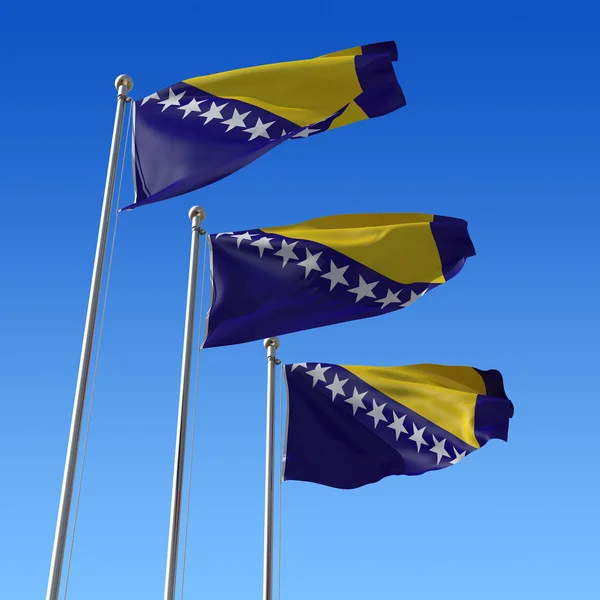 Drie vlaggen van Bosnië en herzegovina tegen blauwe hemel. — Stockfoto