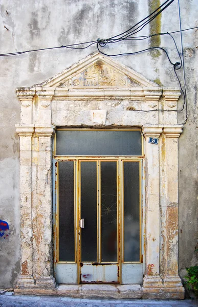Worn down greek doorway — Stock Photo, Image