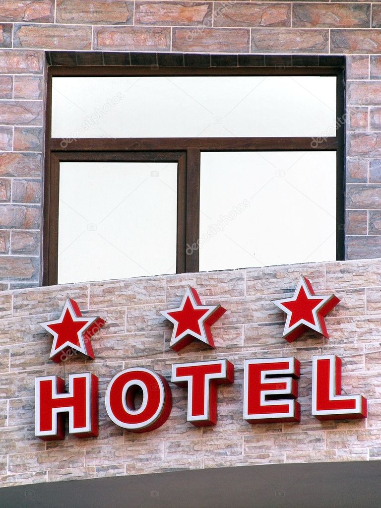 three star hotel sign over an enter