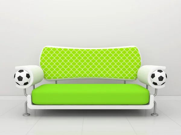Зеленый диван с футбольной символикой — стоковое фото