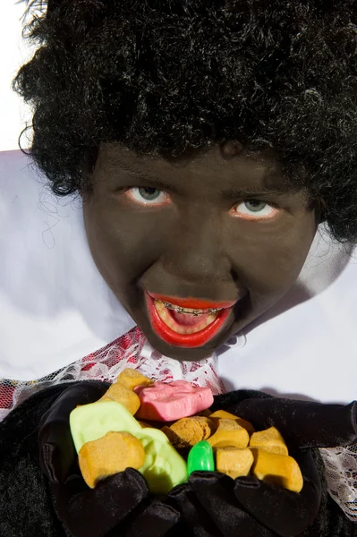 Schwarzes Piet mit Bonbons — Stockfoto