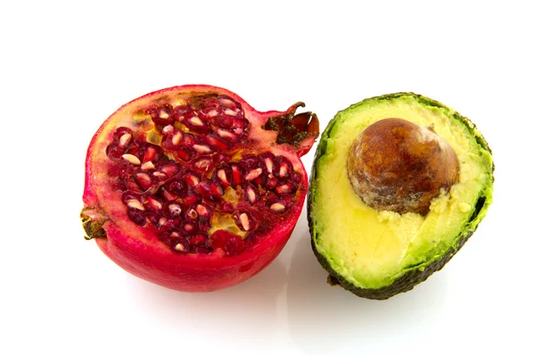 Pitvruchten granaat en avocado — Stockfoto