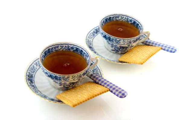 Porcelain cups and saucers with tea — Stock Photo, Image