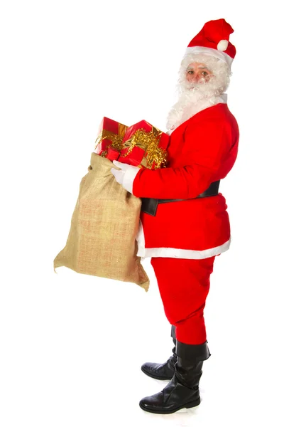 Santa claus met vele presenteert — Stockfoto
