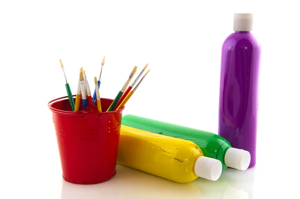 Paint brushes and bottles — Stock Photo, Image