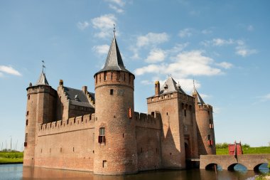 Dutch castle Muiderslot in village Muiden in Holland clipart