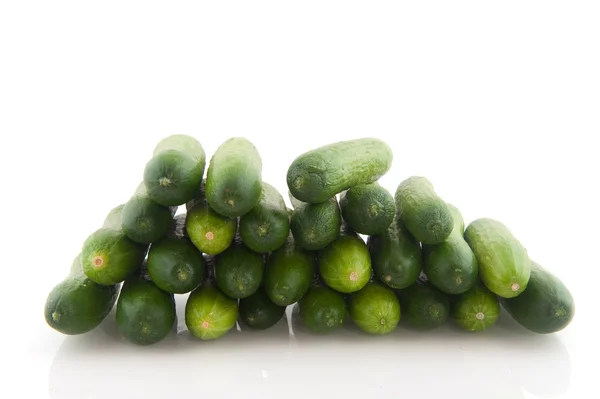 Many Fresh Cucumbers Stacked Isolated White — Stock Photo, Image