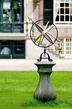 Sundial near the castle clipart