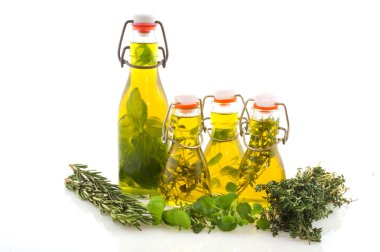 Olive oil verious herbs clipart