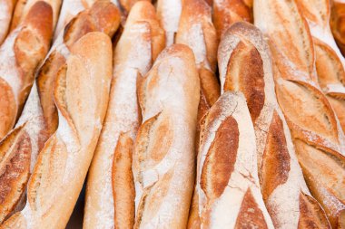 Many fresh baked French baguettes in France clipart