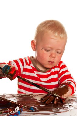 Painting child is making a complete mess clipart