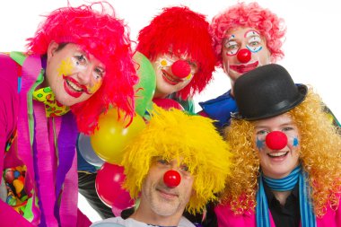 Happy clowns are having a celebration with balloons clipart