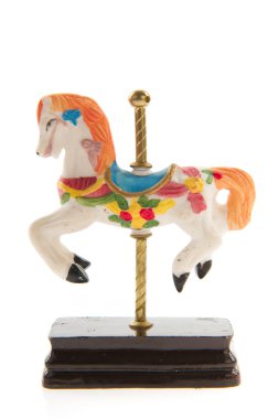 Toy horse from the merry-go-round isolated over white background clipart