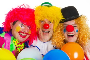 Happy clowns are having a celebration with balloons clipart