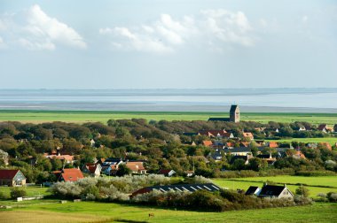 Typical Dutch village Hollum at the wadden island in Holland clipart