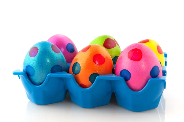 Colorful easter eggs in blue tray — Stock Photo, Image