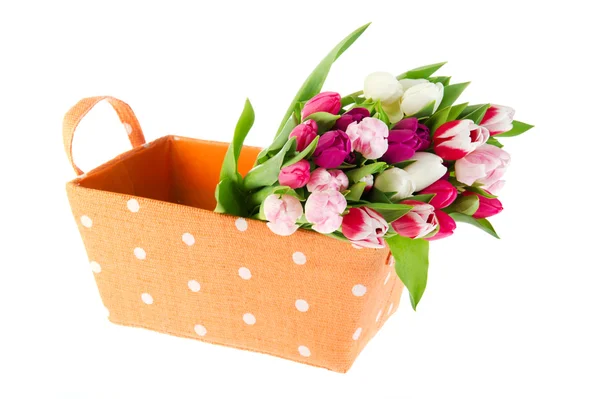Colorful bouquet tulips in orange basket — Stock Photo, Image