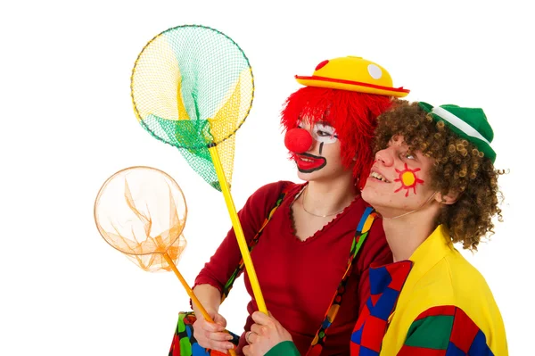 Paar grappige clowns met visnetten — Stockfoto