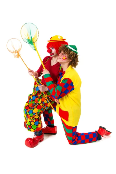 Couple funny clowns with fishing nets — Stock Photo, Image
