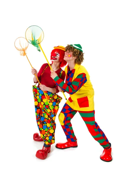 Paar grappige clowns met visnetten — Stockfoto