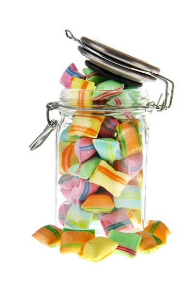 Glazen pot met kleurrijke snoep — Stockfoto