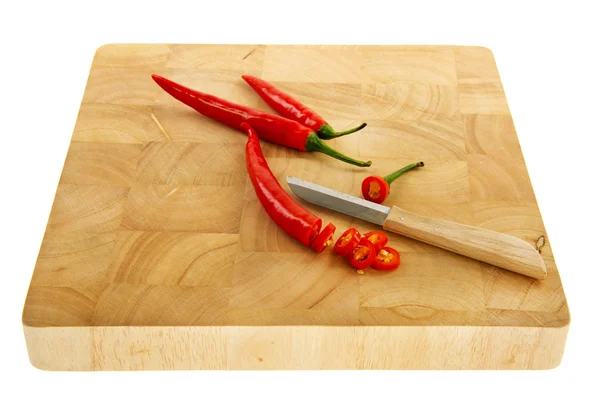 Cutting hot peppers — Stock Photo, Image