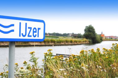 River IJzer with Diksmuide in the back, Flanders, Belgium, Europe clipart