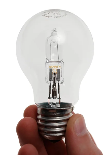 stock image Halogen bulb in hand. Isolated on white