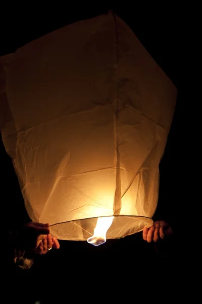 stock image Playing with flying lantern in the night