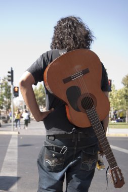 Guitar player in the street clipart