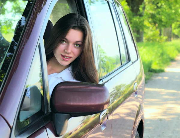 Girl in car. — Stock Photo, Image
