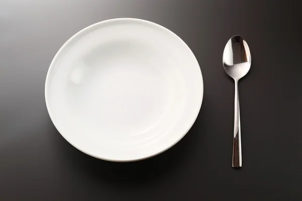 Cucchiaio e piatto — Foto Stock