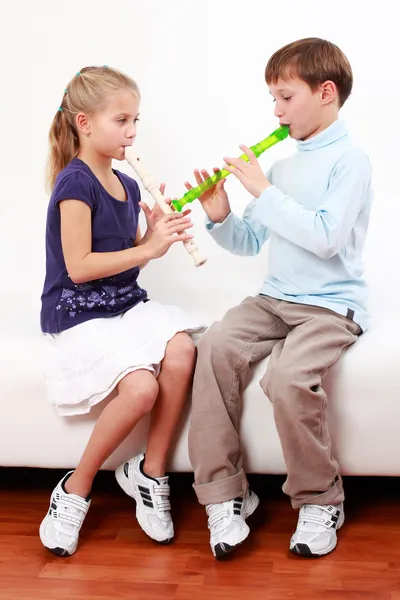 Kids playing flute — Stock Photo, Image