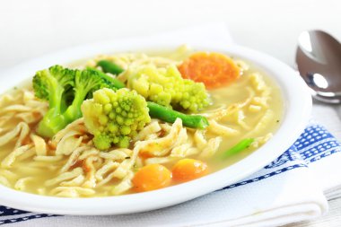 Chicken noodle soup with sorted vegetable clipart