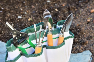 Detail of gardening tools in tool bag - outdoor clipart