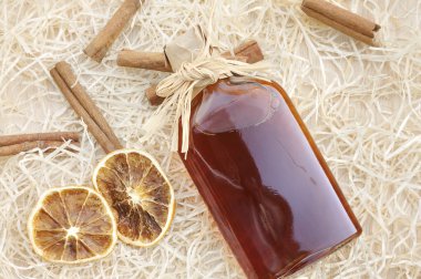 Homemade liqueur with spices clipart