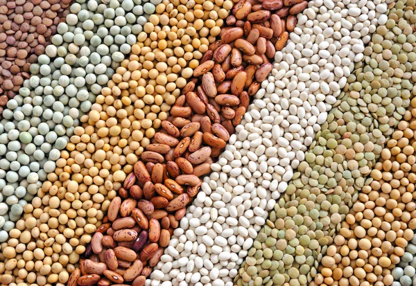 Mischung aus getrockneten Linsen, Erbsen, Sojabohnen, Bohnen - Hintergrund — Stockfoto