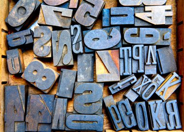 Many old woodent fonts in wooden case, many letters clipart