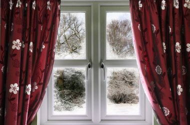 Window view to a snow scene clipart