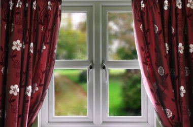 Window with curtains and a shallow depth of field clipart