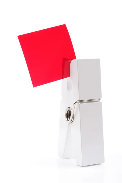 Clavija Blanca Sosteniendo Cuadrado Rojo Aislado —  Fotos de Stock