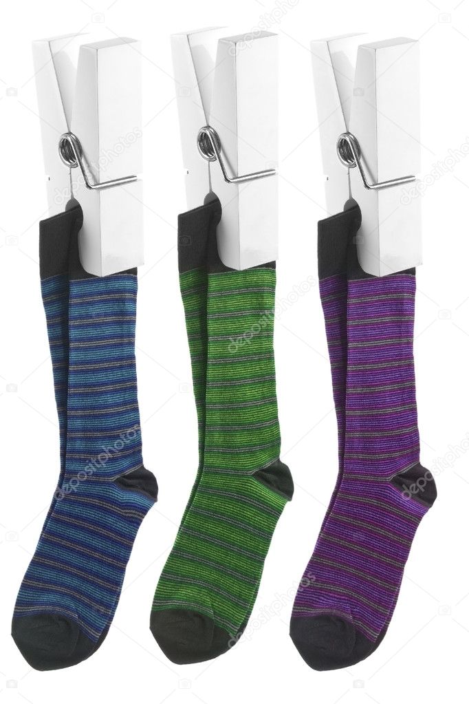 White pegs holding up striped socks