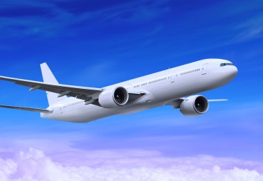 Beyaz yolcu uçağı mavi gökyüzüne iniyor.