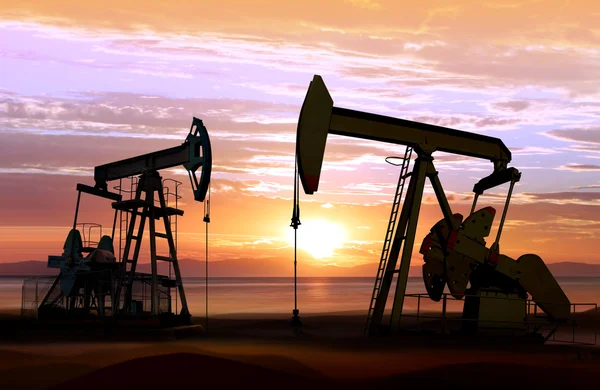 Oil pumps on sunset — Stock Photo, Image