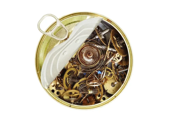 Canned time - parts of clockwork mechanism in the can — Stock Photo, Image