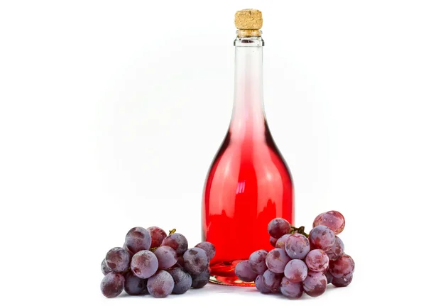 Розовое вино и виноград — стоковое фото