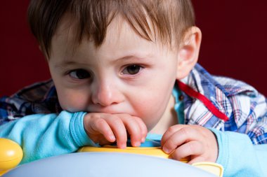 Baby taken close up with sad face clipart