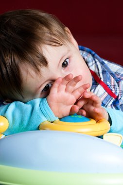 Baby taken close up with sad face clipart