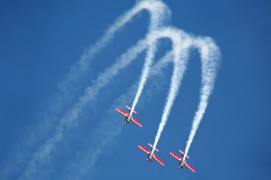 Three airplanes Extra EA-300 on airshow clipart