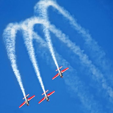 Three airplanes in formation on airshow clipart